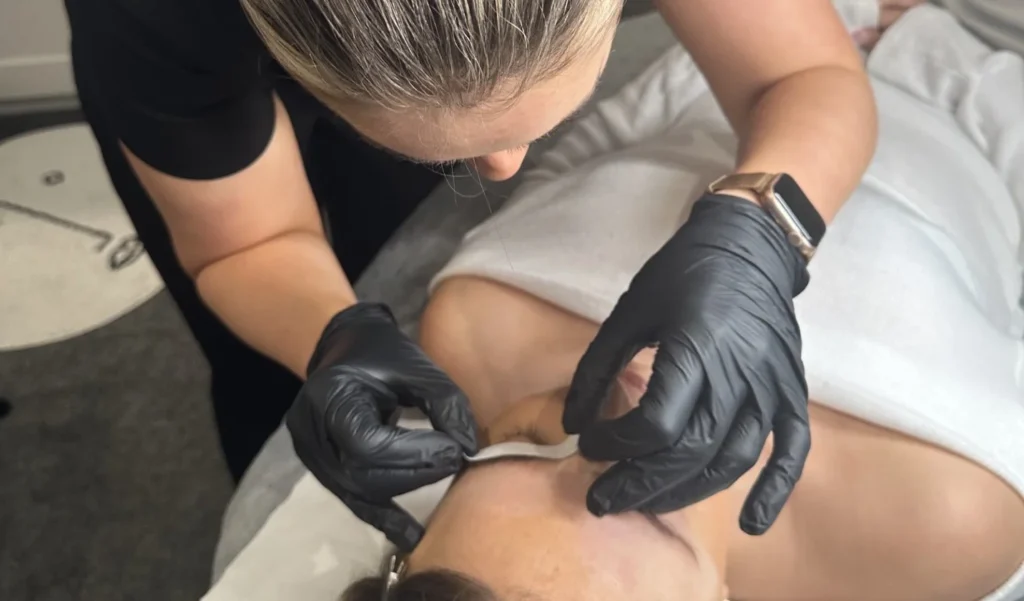 A woman receiving a treatment at Skyn & Glo